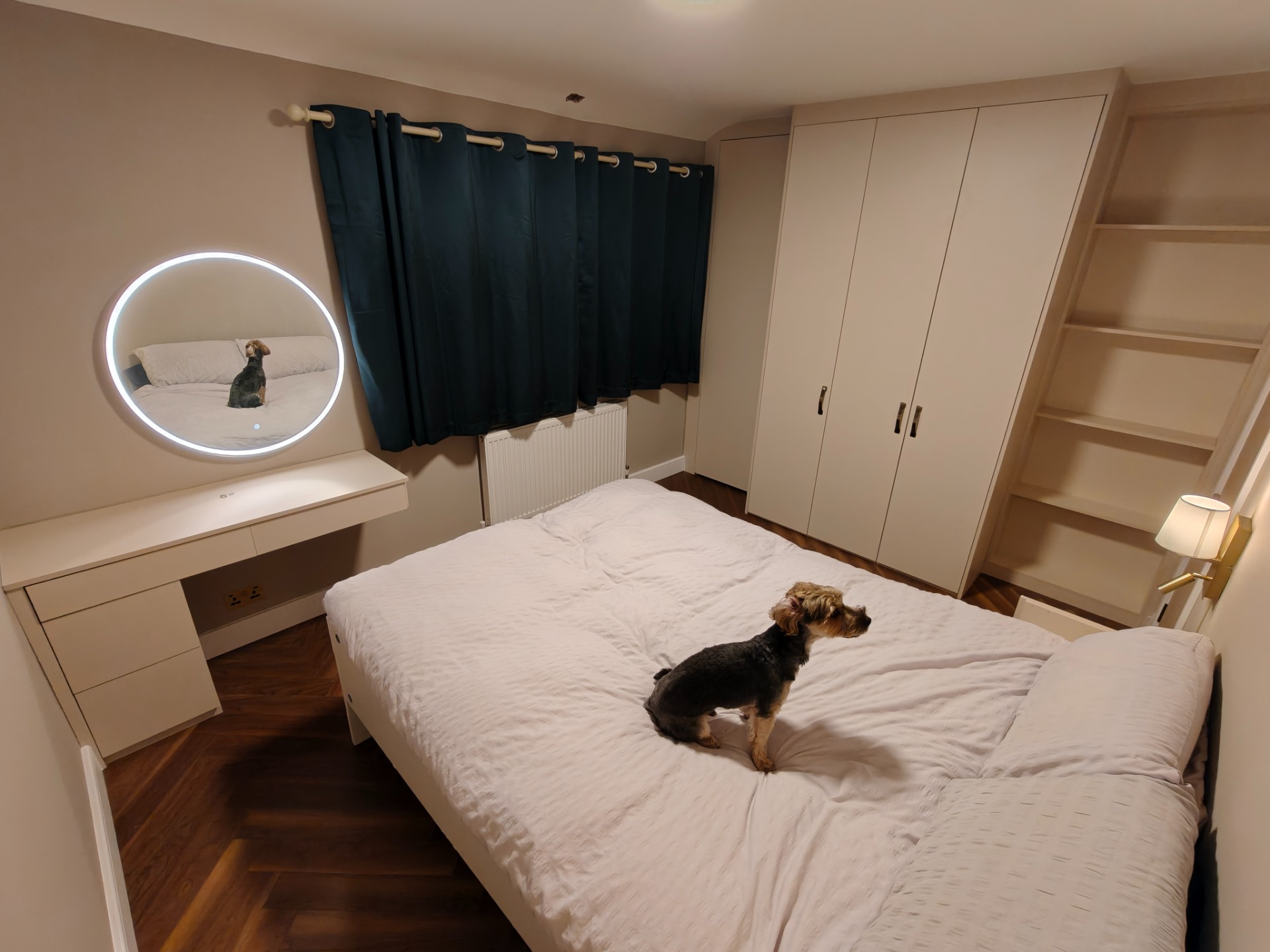 Fitted bedroom wardrobes with dressing table and lit mirror