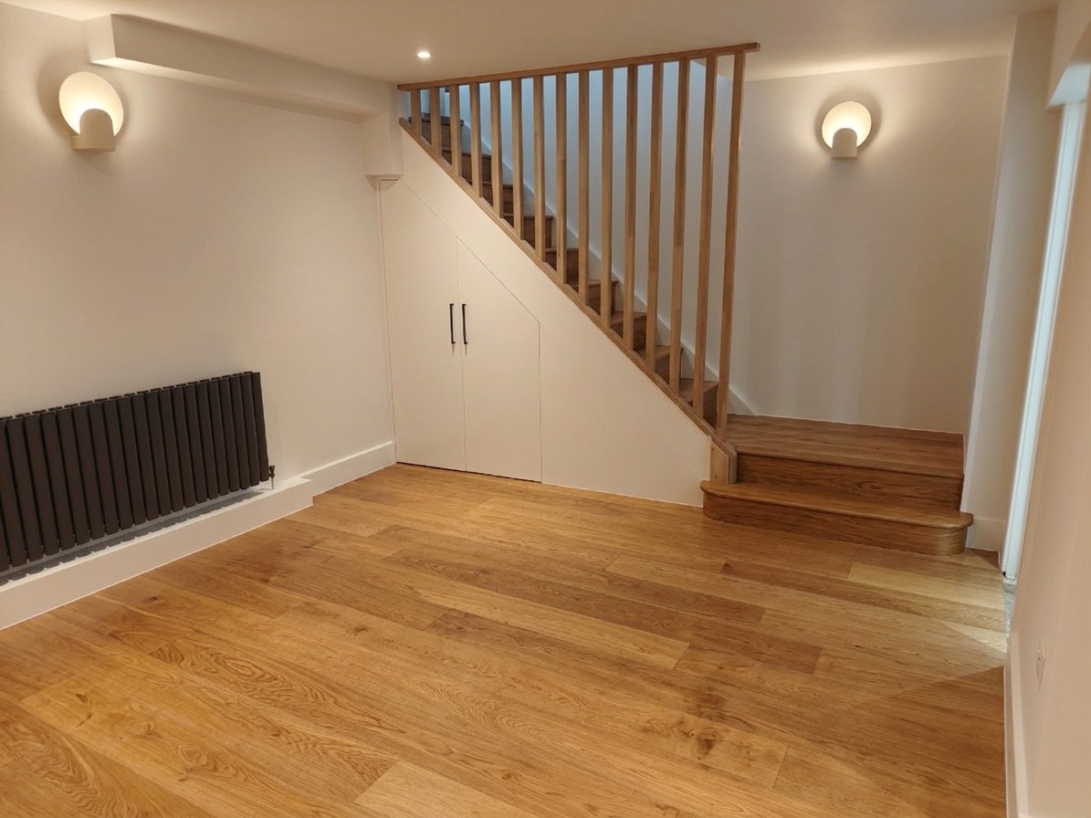 Oak staircase with balustrade and understairs storage